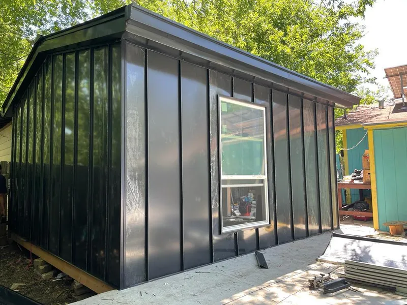 Black standing seam metal wall panels for Roof Inspection in CaÃ±on City