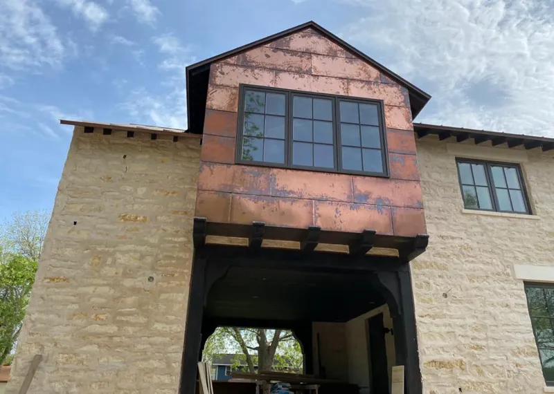 Copper metal panel facade on a stone building for Skylight Installation in CaÃ±on City