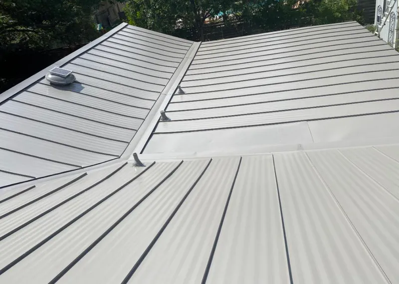 Solar attic fan installed on a metal roof for Roof Ventilation in CaÃ±on City